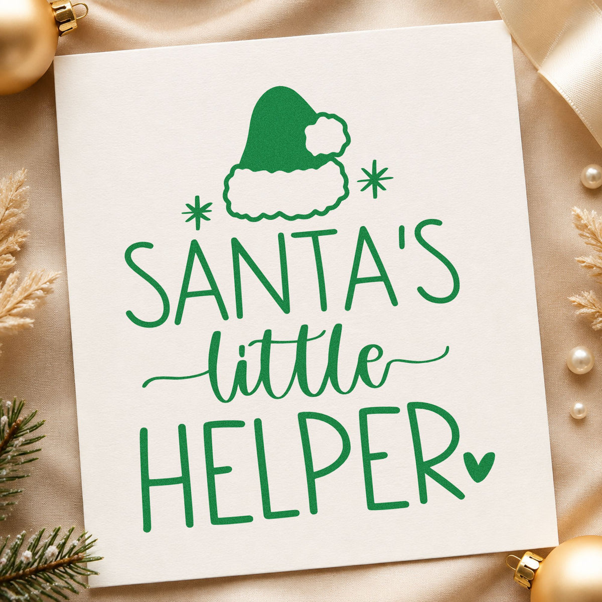 Santa's Little Helper Hat craft stamp imprint in green ink on a handmade project, one idea being sibling badge cards.