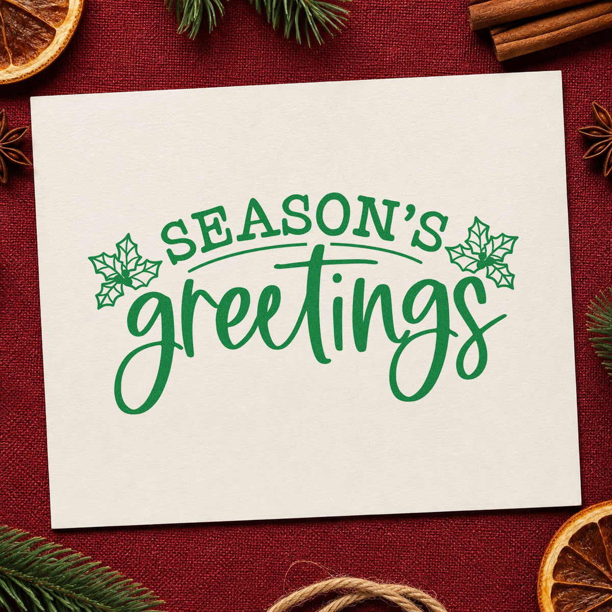 Season's Greetings Holly craft stamp imprint in green ink on a handmade project, one idea being sample pack inserts.