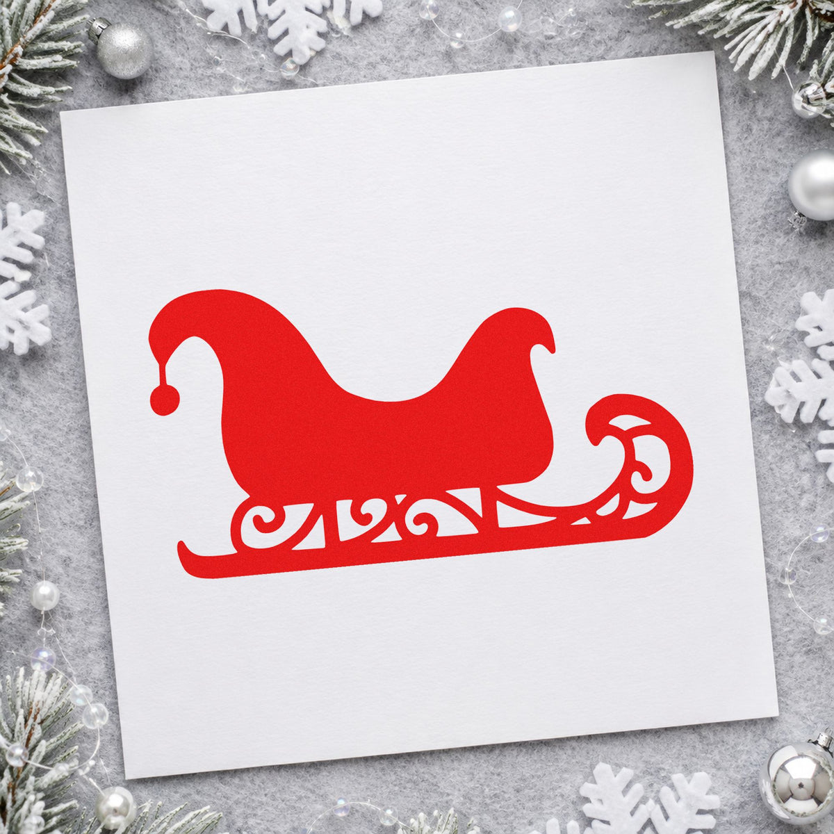 Decorative Santa Sleigh rubber stamp shown in red ink, stamped for projects such as wax sleigh seals.