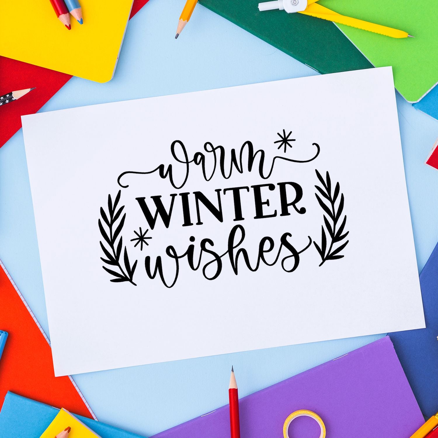 Warm Winter Wishes rubber stamp design for holiday cards, featuring hand-lettered script with festive leafy accents.