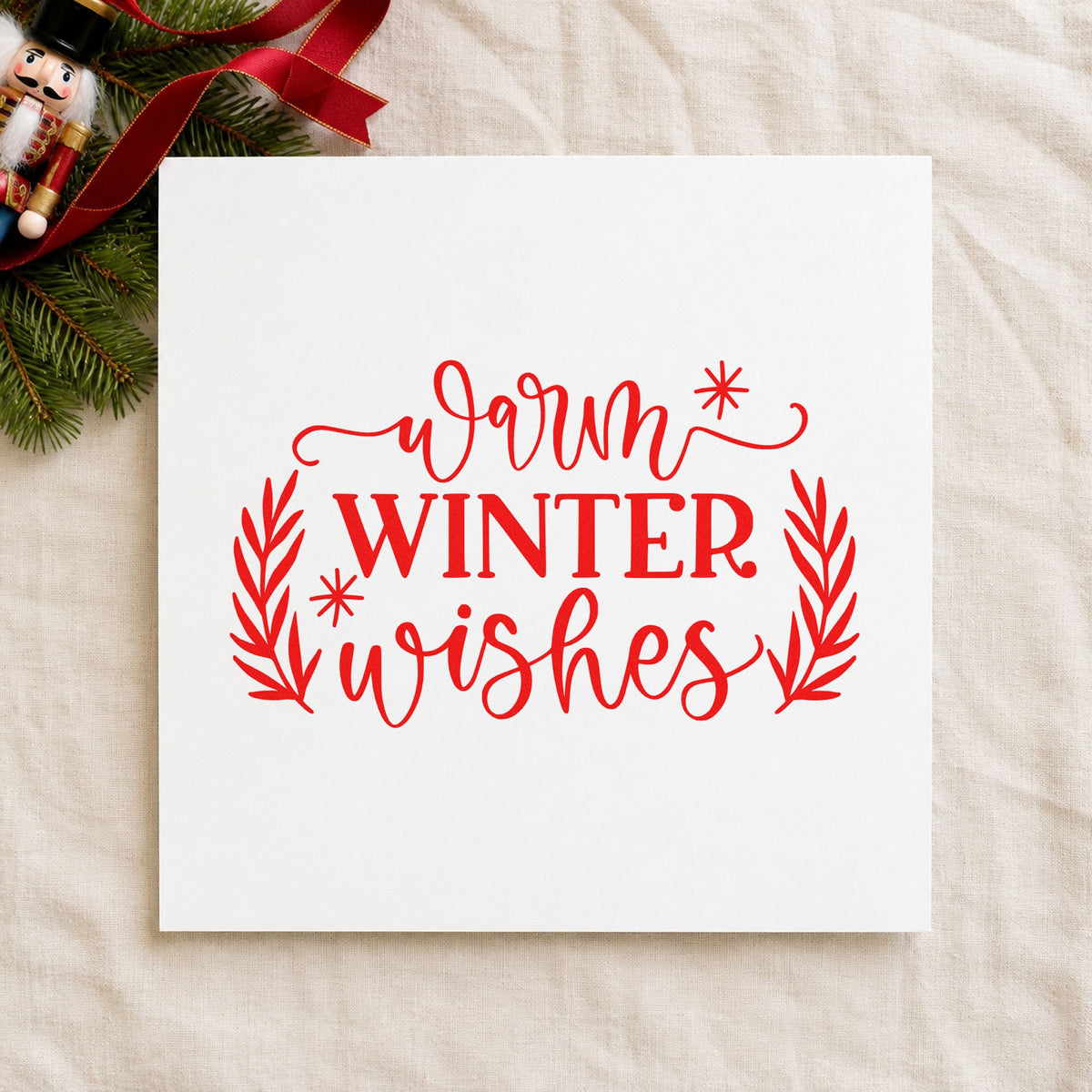Warm Winter Wishes craft stamp in red ink on cardstock, an easy option for blanket corner ink.
