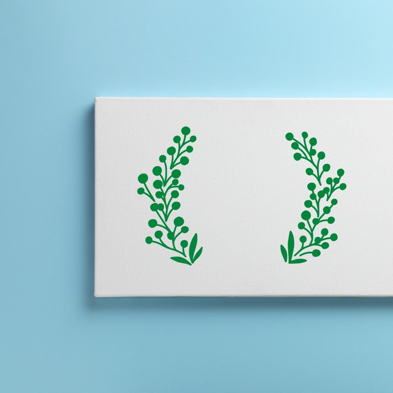 Botanical laurel branch rubber stamp design with green foliage on a white card mockup.