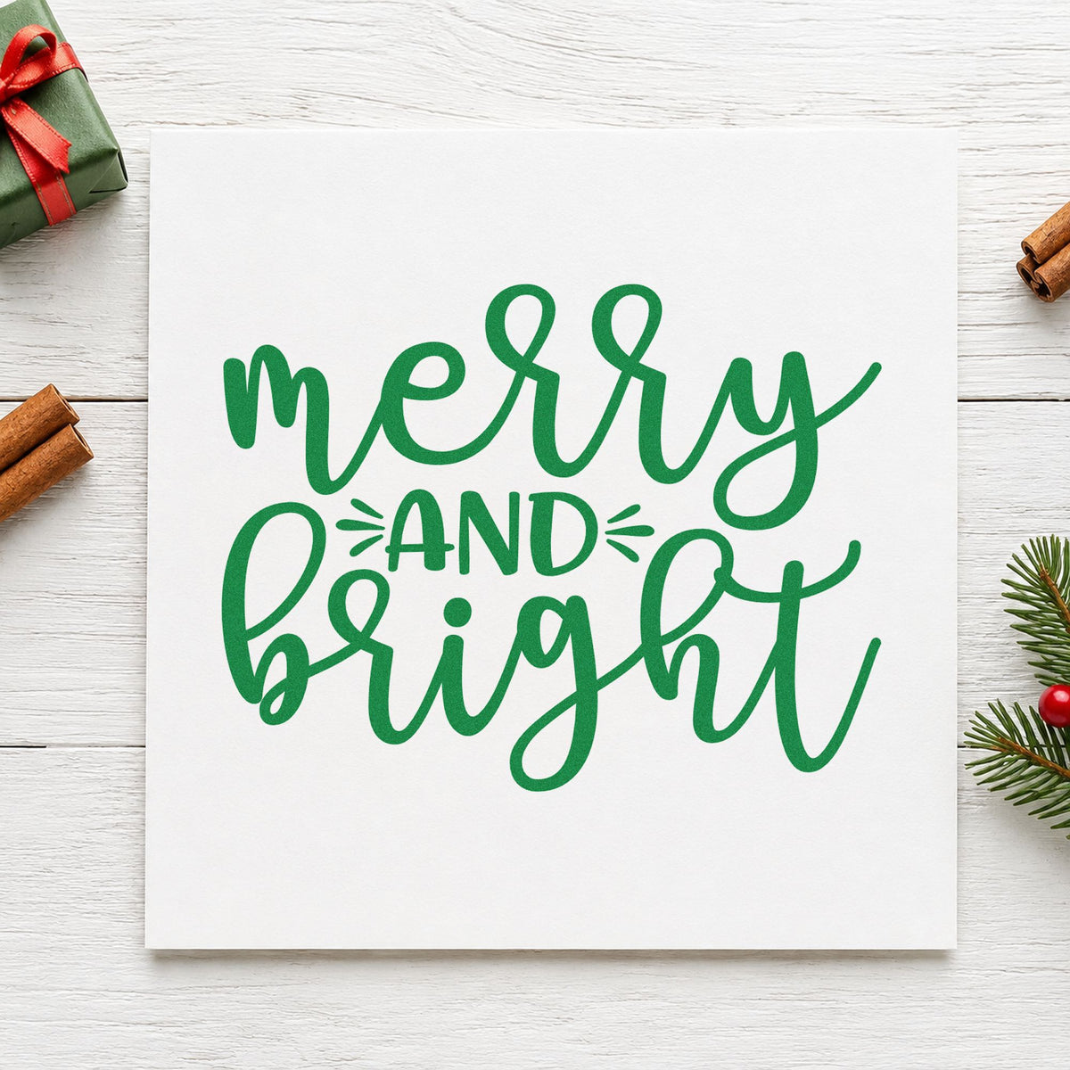 Merry And Bright Script craft stamp imprint in green ink on a handmade project, one idea being service ticket slips.