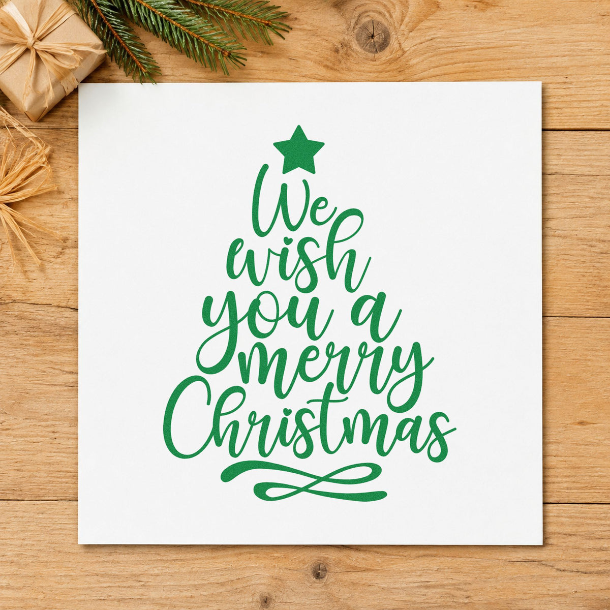 We Wish Merry Christmas Tree craft stamp imprint in green ink on a handmade project, one idea being neighborhood flyers.