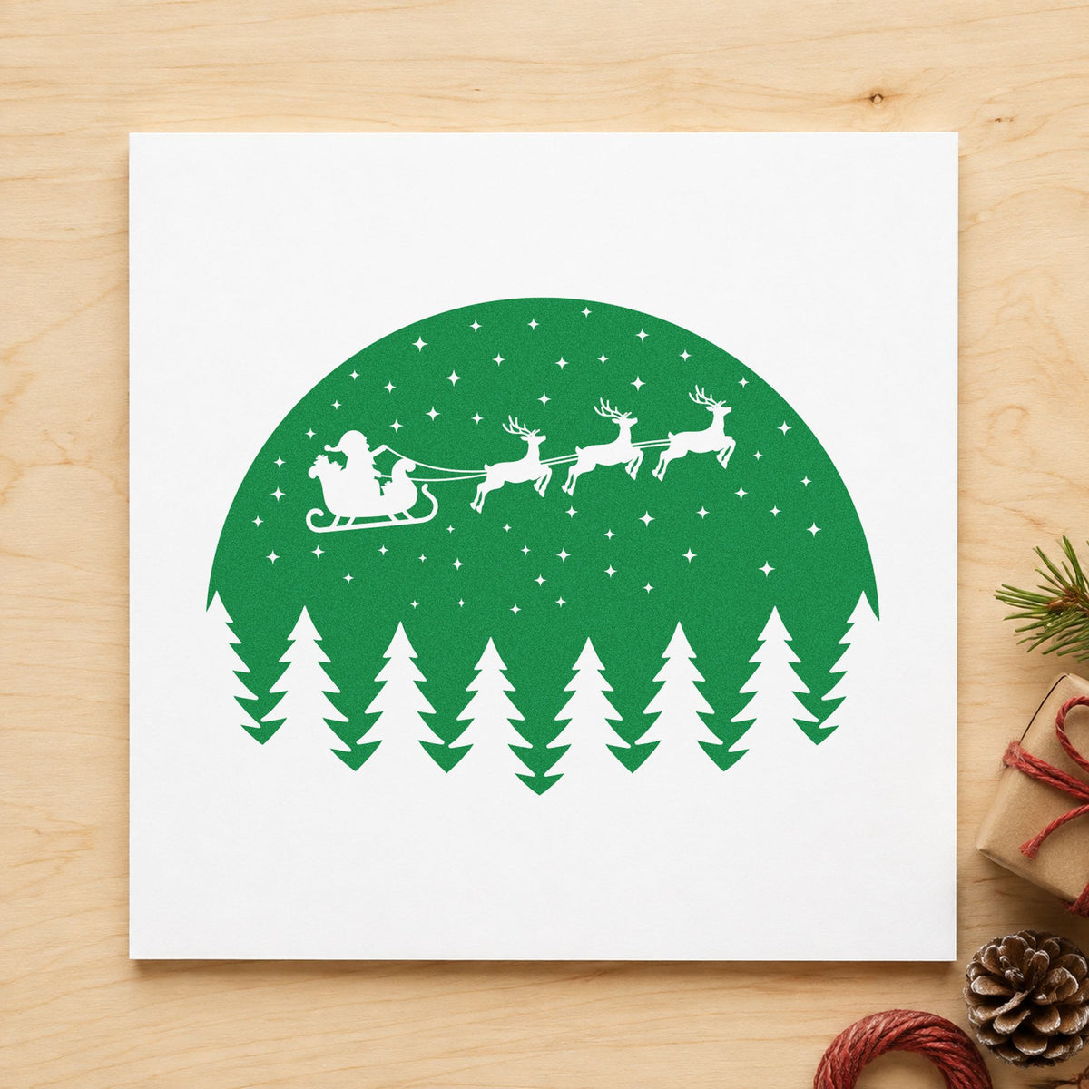 Santa Sleigh Snowy Forest Circle craft stamp imprint in green ink on a handmade project, one idea being kraft board tags.