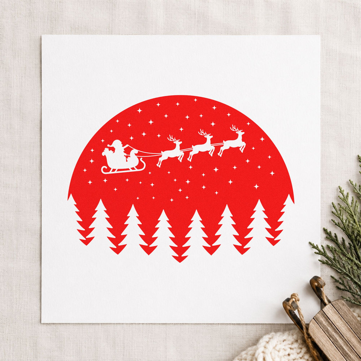 Santa Sleigh Snowy Forest Circle craft stamp in red ink on cardstock, an easy option for denim panel printing.