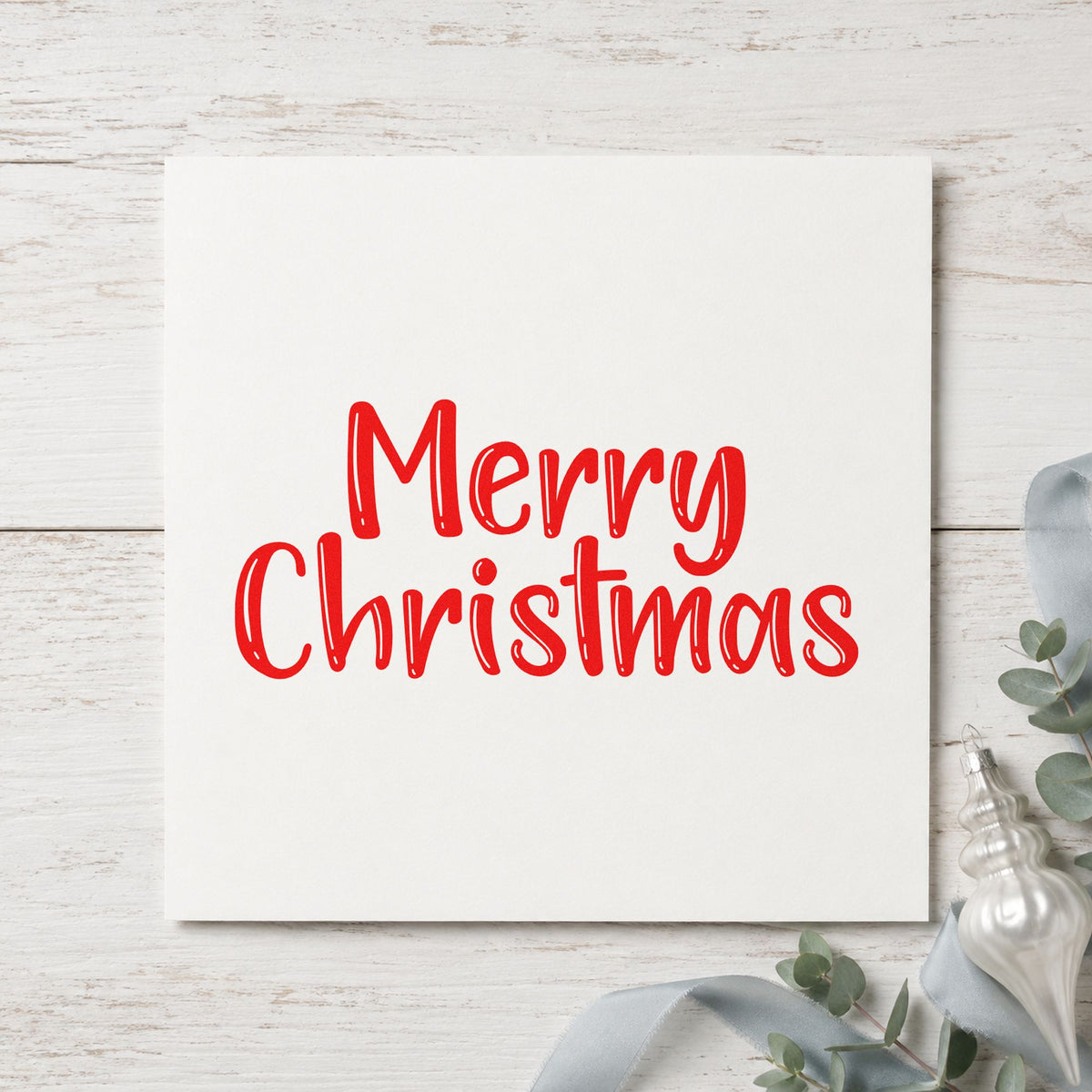 Merry Christmas Textured Letters craft stamp in red ink on cardstock, an easy option for burlap sack printing.