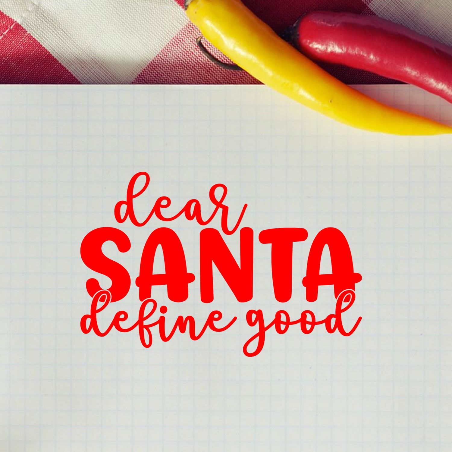Red Dear Santa, define good Christmas rubber stamp design on graph paper background for holiday card crafting.