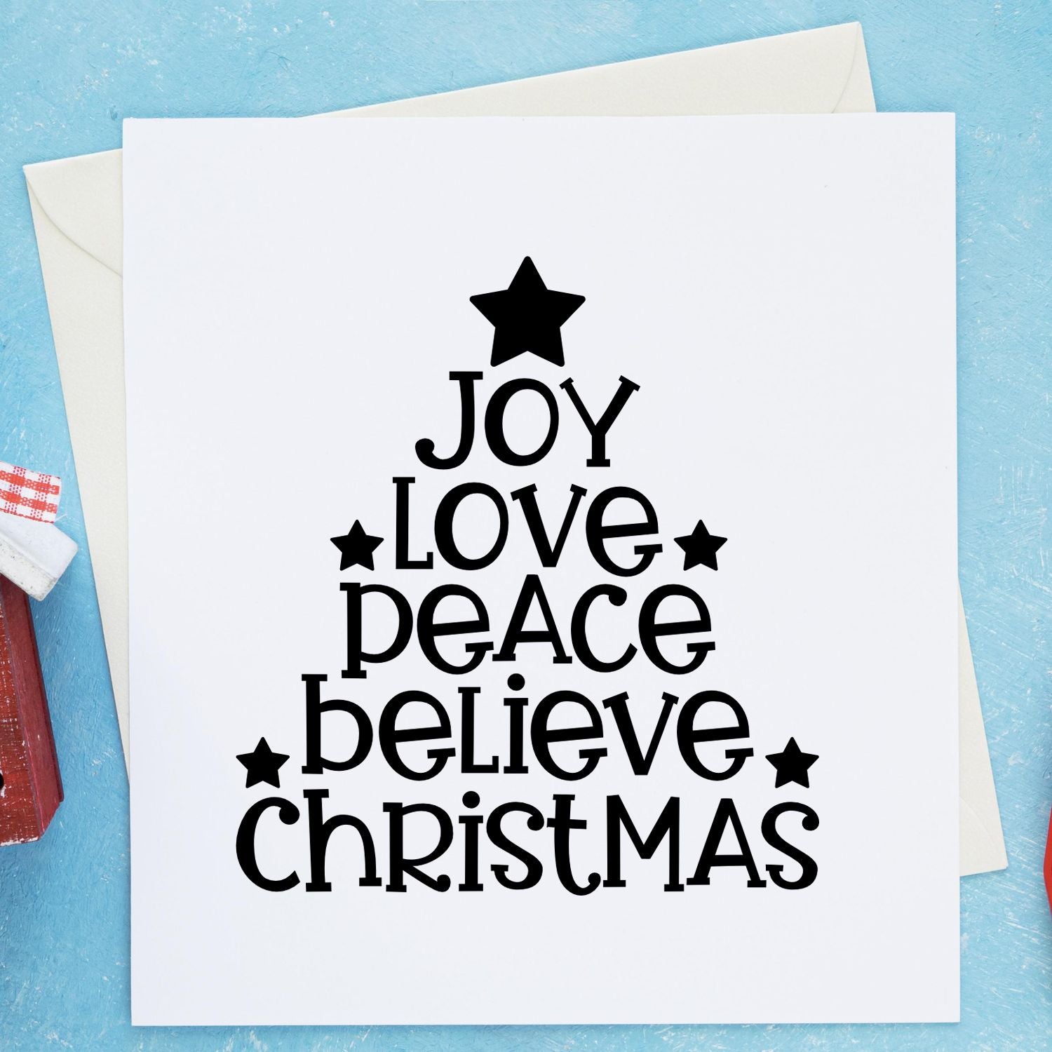 Christmas tree rubber stamp design with Joy, Love, Peace, Believe, and Christmas for festive holiday card making.