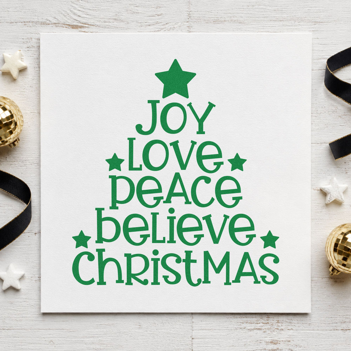 Joy Love Peace Christmas Tree craft stamp imprint in green ink on a handmade project, one idea being layered gift tags.