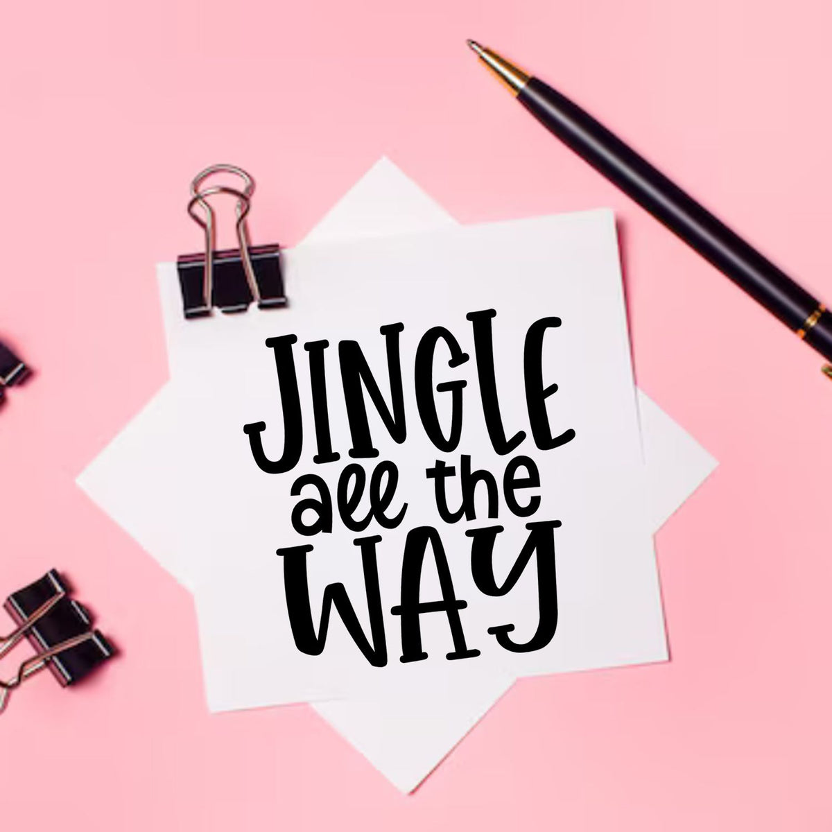 Jingle All The Way Lettering Premium Wooden Stamp - Vintage Pro imprint stamped in black ink. "Jingle All the Way" uses tall hand-drawn lettering in three rows.