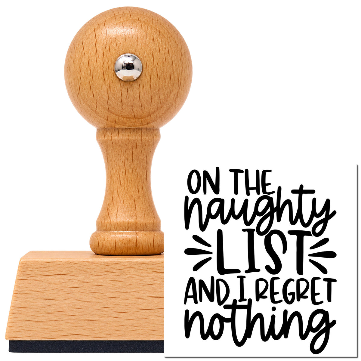 Naughty List Regret Nothing Lettering Vintage Pro rubber stamp in European beech wood with a round knob handle, shown beside its black imprint.