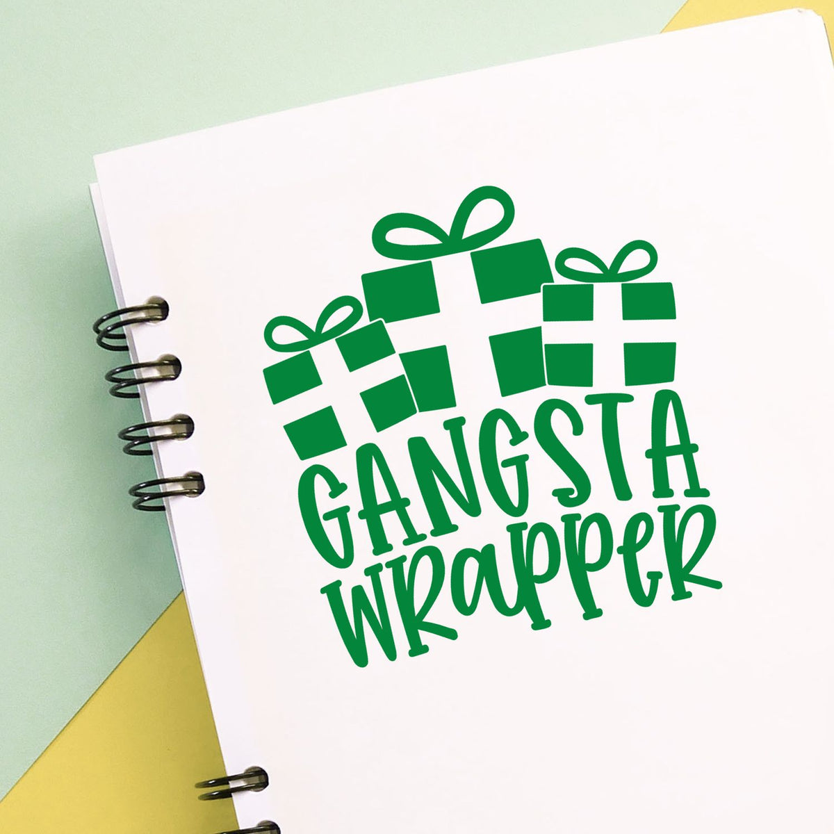 Gangsta Wrapper Presents rubber stamp shown in green ink, stamped for projects such as wrapping album page.