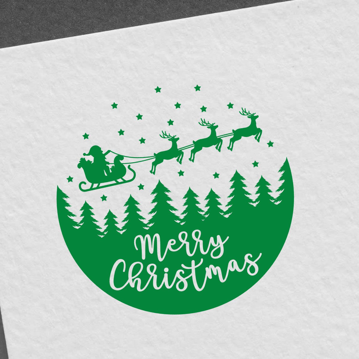 Merry Christmas Sleigh Forest Circle rubber stamp shown in green ink, stamped for projects such as ornament craft album.