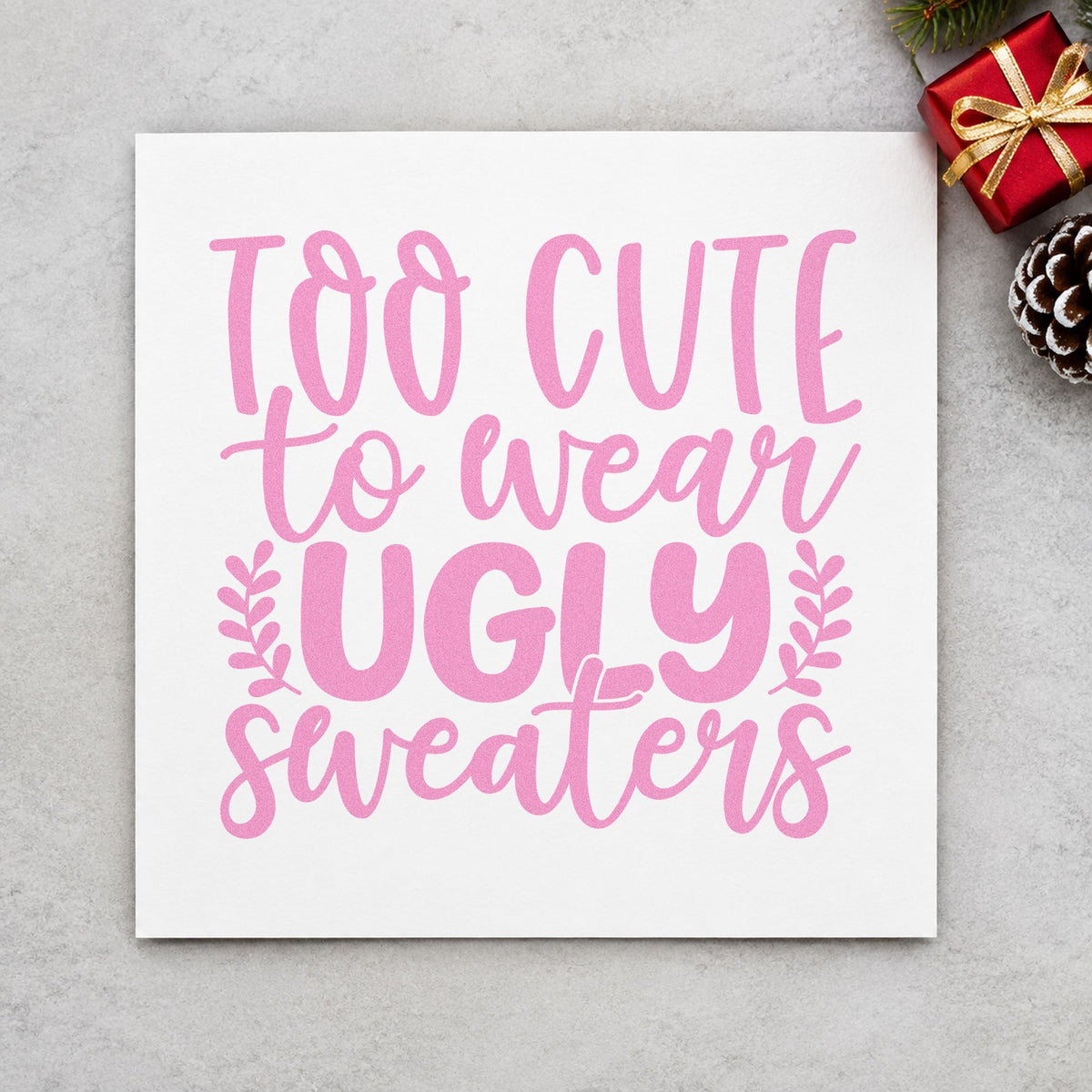Too Cute Wear Ugly Sweaters craft stamp in purple ink on cardstock, an easy option for dorm room album page.