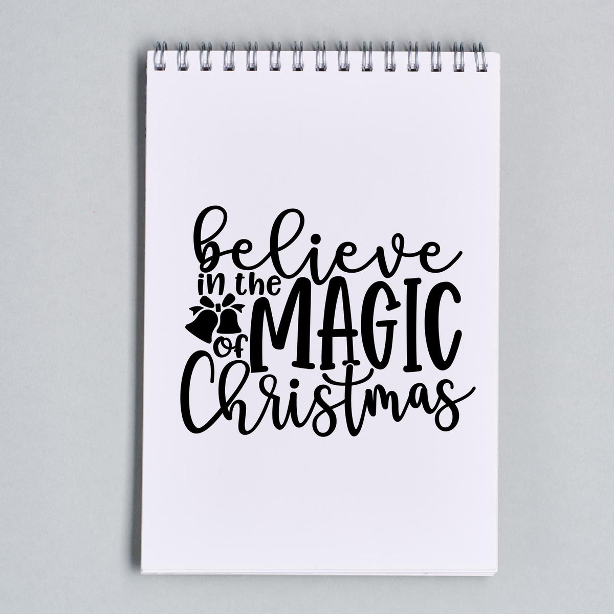 Believe Magic Christmas Holly Premium Wood-Mounted Stamp - Vintage Pro imprint stamped in black ink. "Believe in the Magic of Christmas" is accented with a small holly sprig.