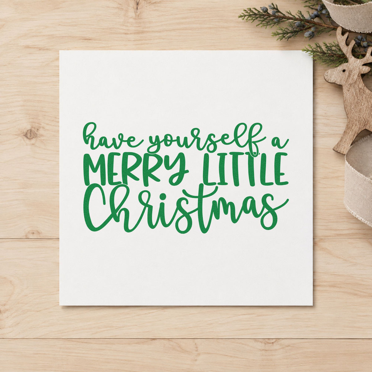 Have Yourself Merry Little Christmas craft stamp imprint in green ink on a handmade project, one idea being supper club menus.