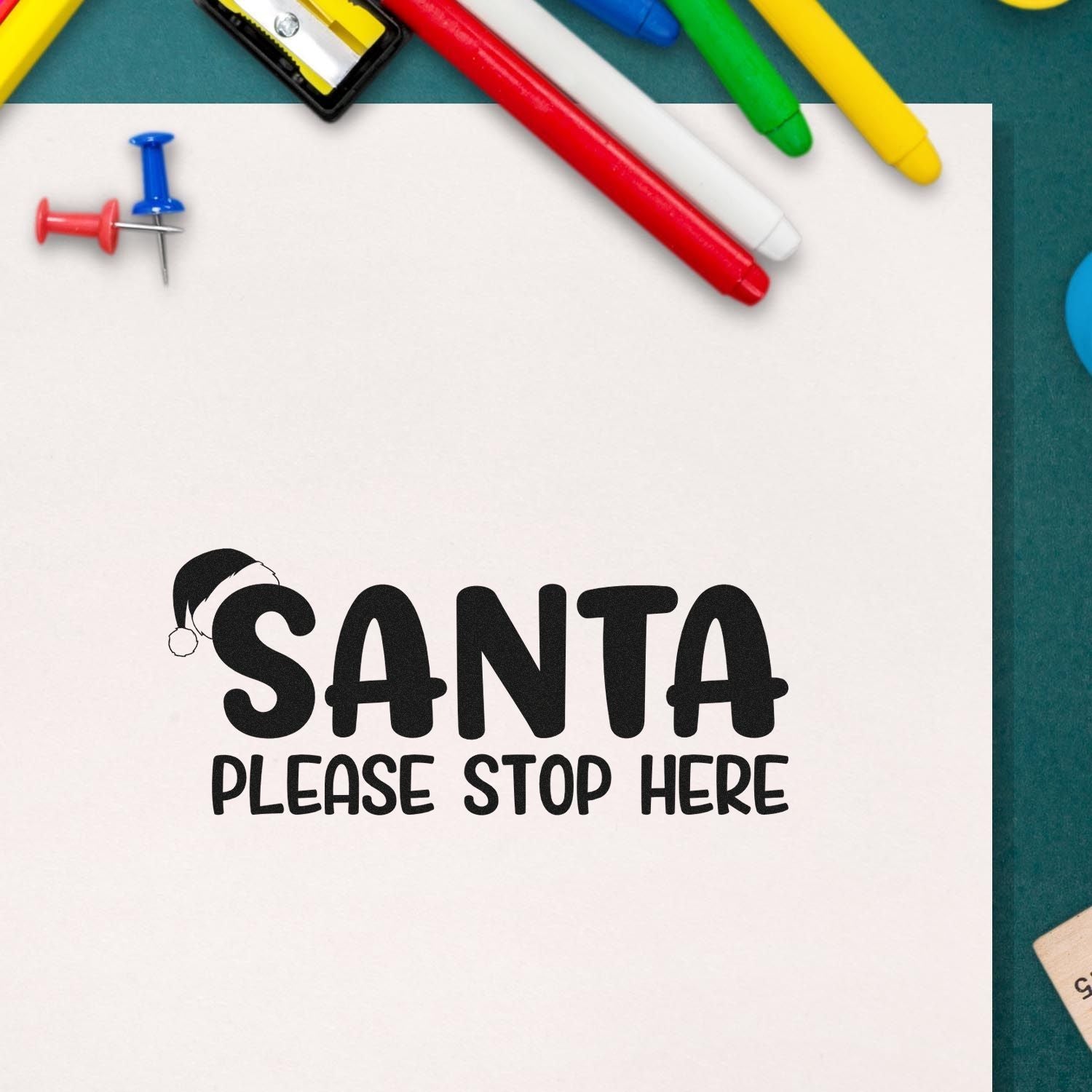 Santa Please Stop Here Christmas rubber stamp design with Santa hat, ideal for holiday notes and gift tags.