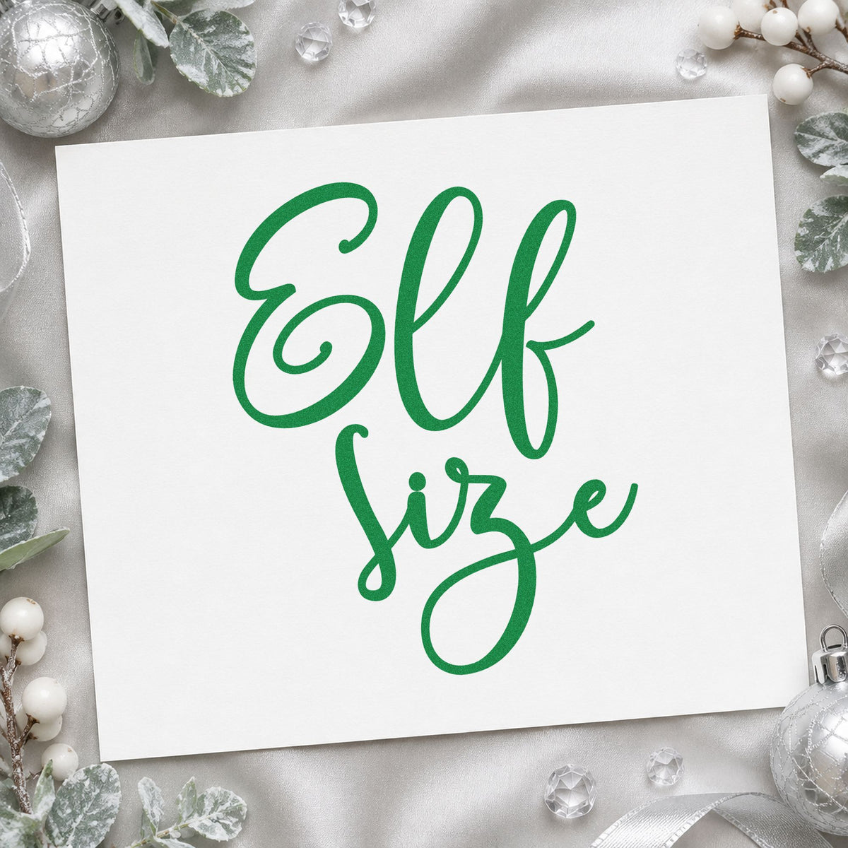 Elf Size Script craft stamp imprint in green ink on a handmade project, one idea being costume rack placards.