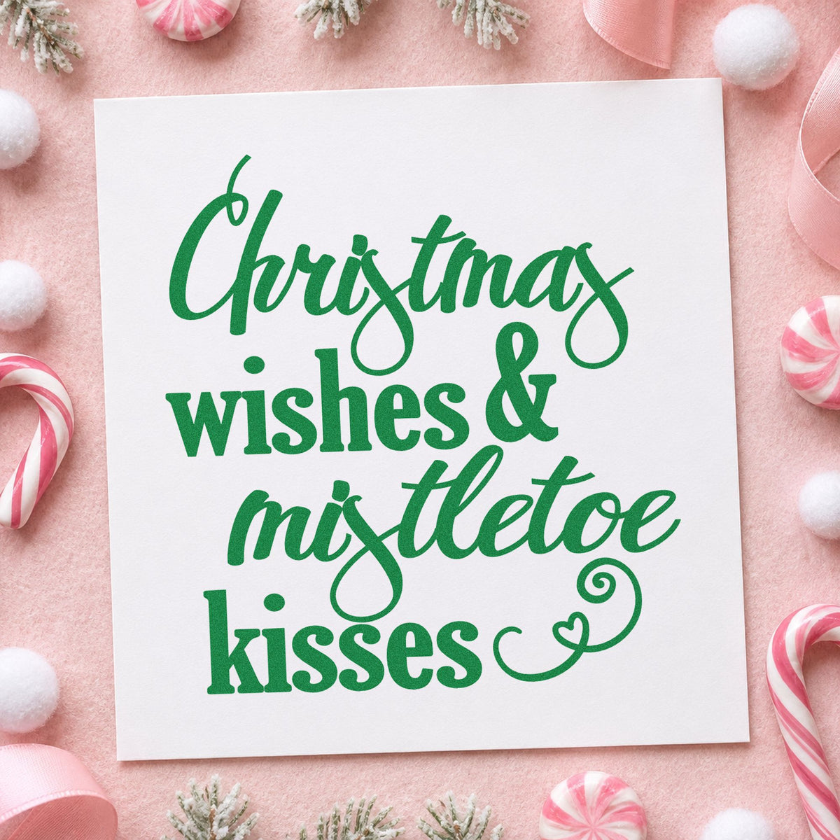 Christmas Wishes Mistletoe Kisses craft stamp imprint in green ink on a handmade project, one idea being two gift tags.