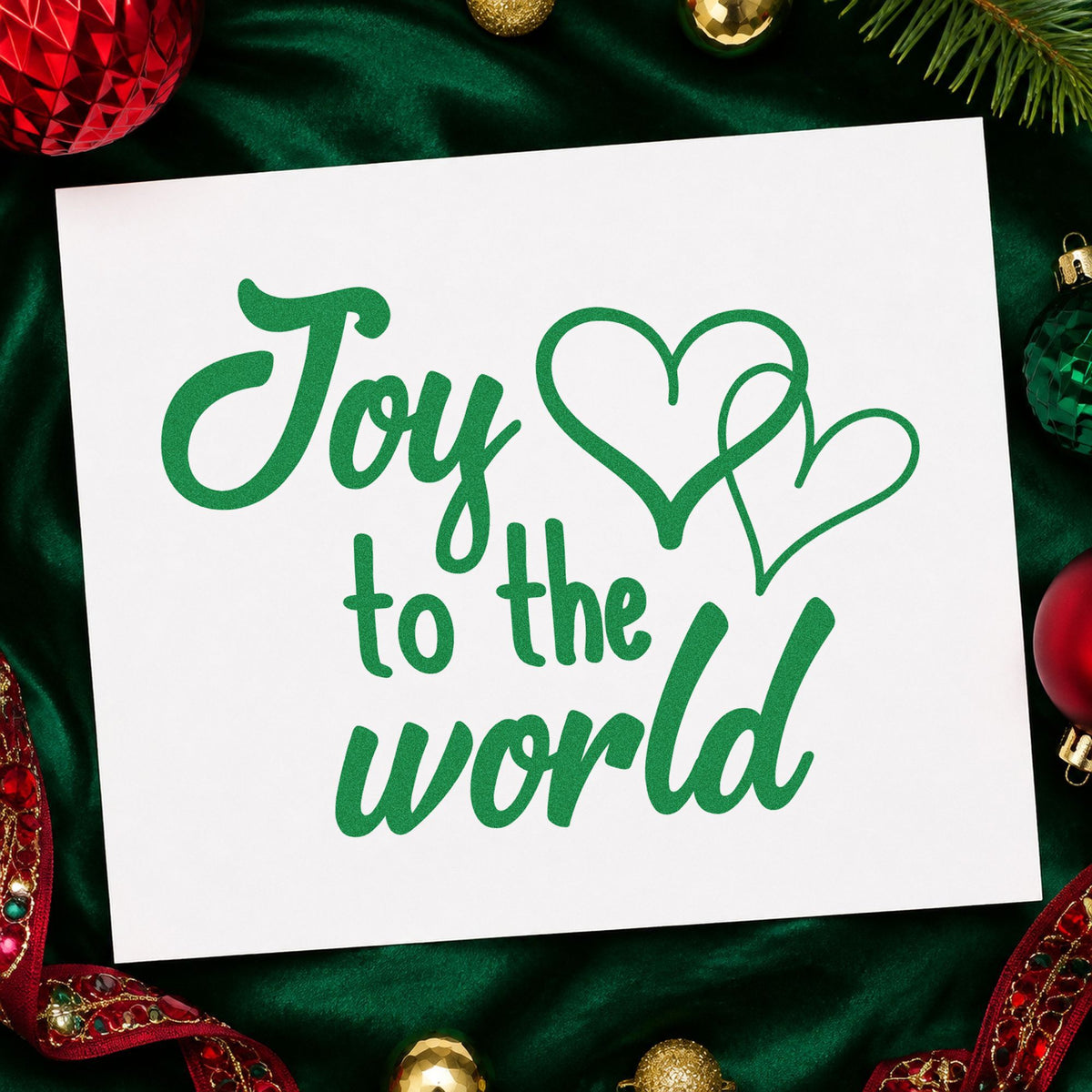 Joy To World Hearts craft stamp imprint in green ink on a handmade project, one idea being donation gift tags.