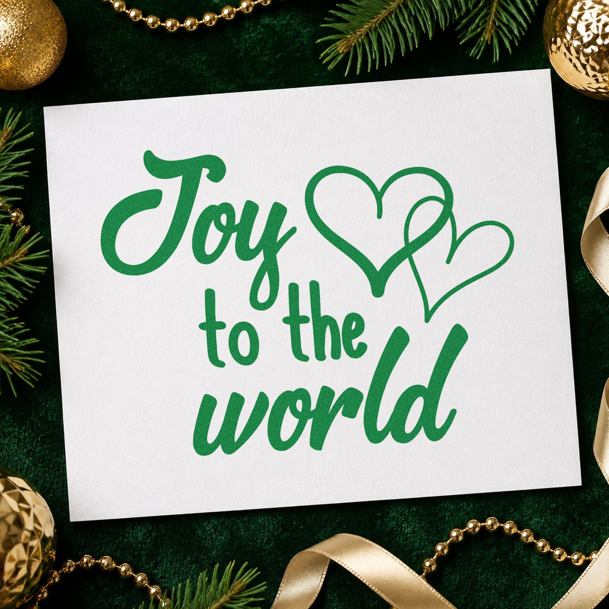 Joy To World Hearts craft stamp imprinted in green ink on paper, a design suited to framed food bank wall.