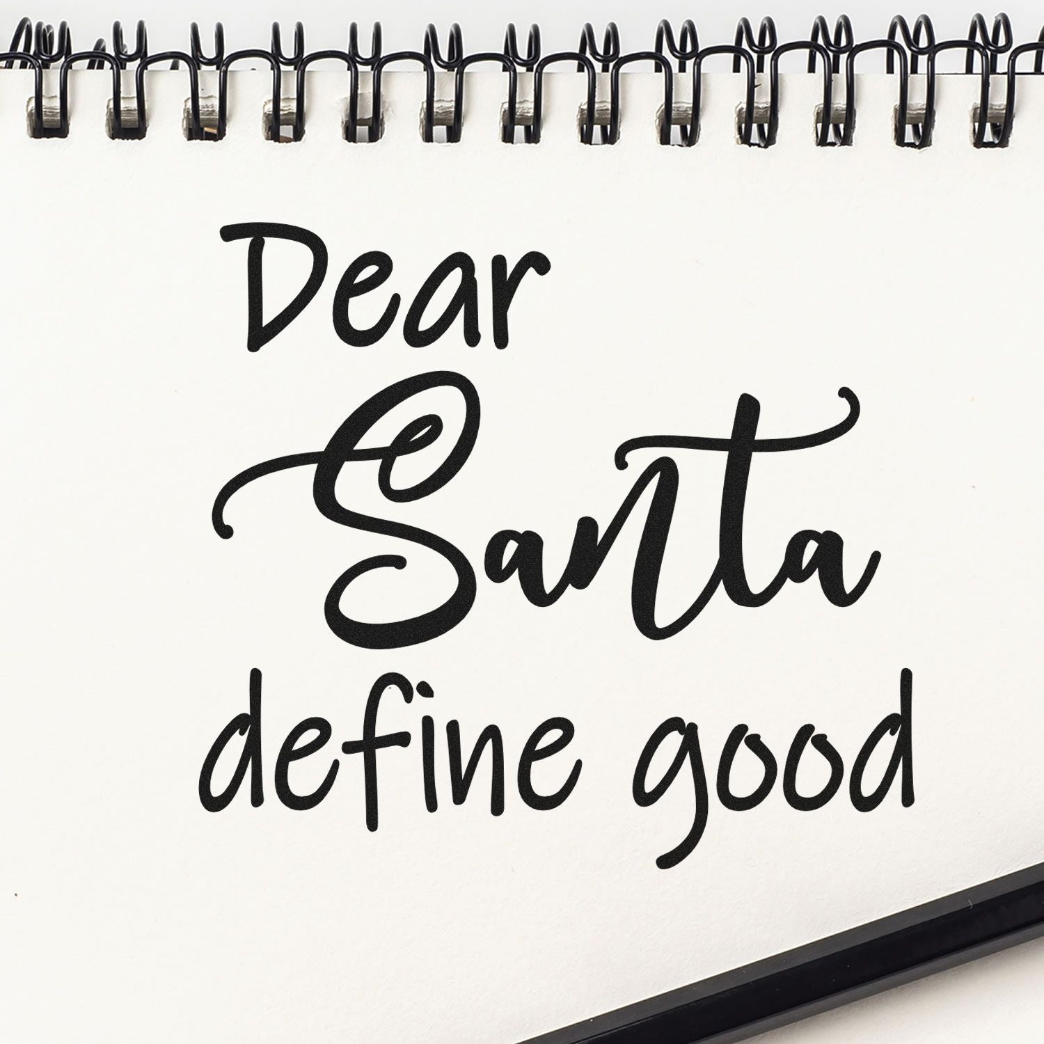 Christmas rubber stamp design reading Dear Santa, define good in playful script for holiday crafting and cards.