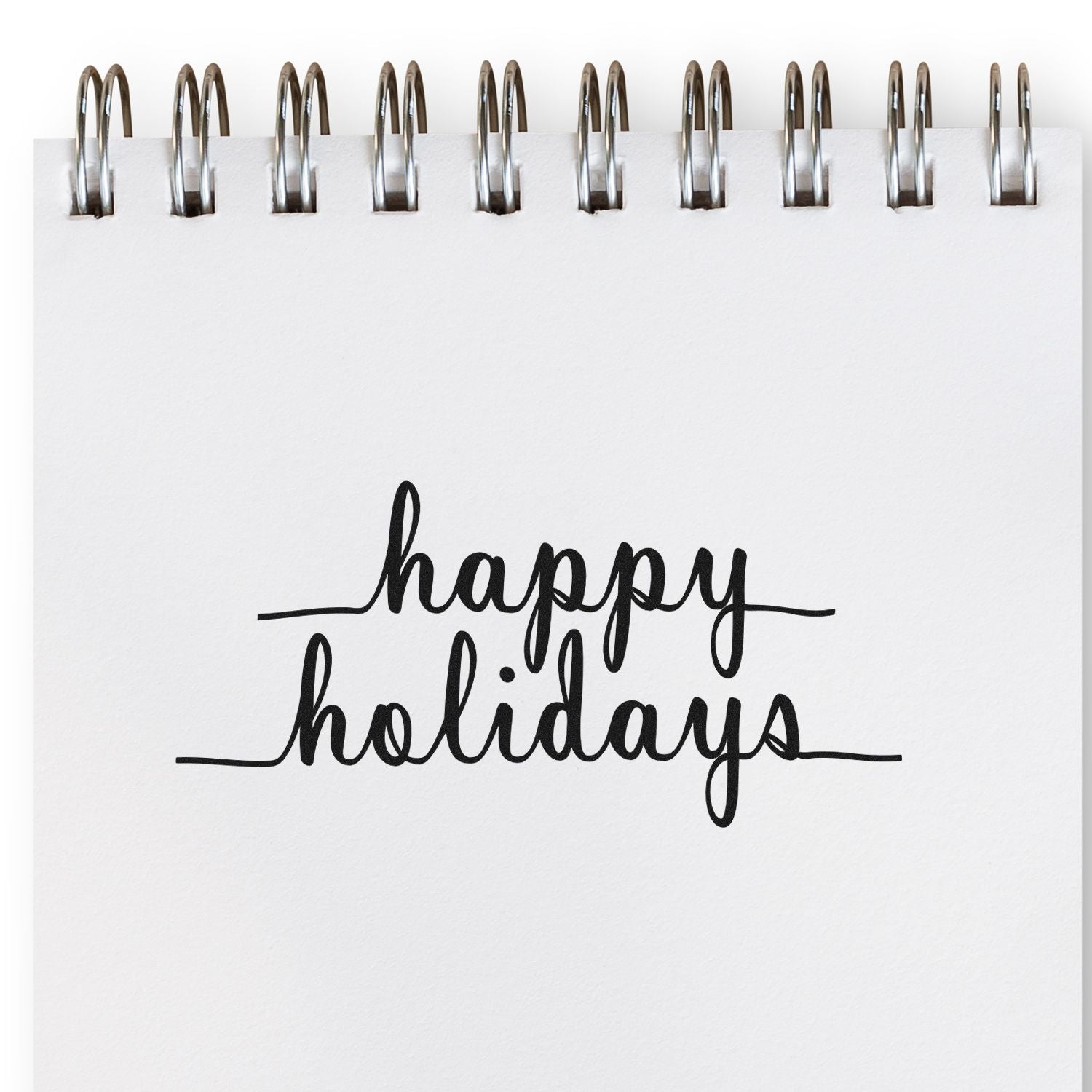 Happy Holidays rubber stamp design in elegant script on a spiral notebook page for seasonal cards, gifts, and packaging.