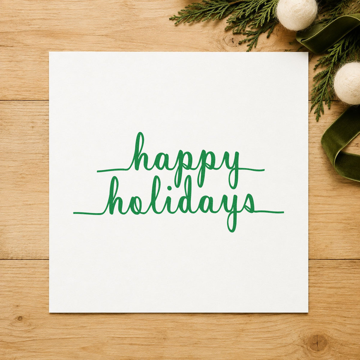 Happy Holidays Underlined Script craft stamp imprint in green ink on a handmade project, one idea being belly band tags.