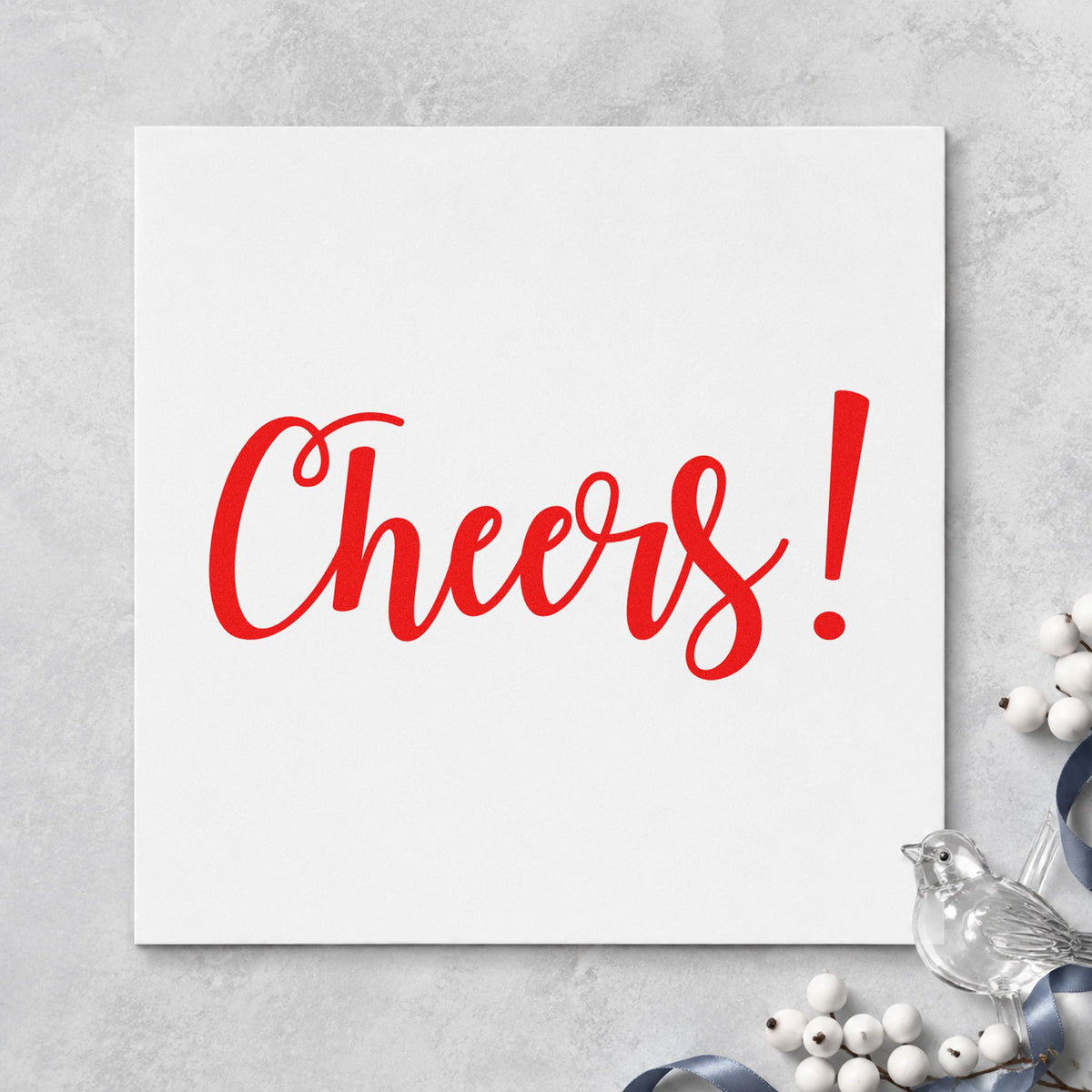 Cheers Flowing Script craft stamp in red ink on cardstock, an easy option for bar mat printing.