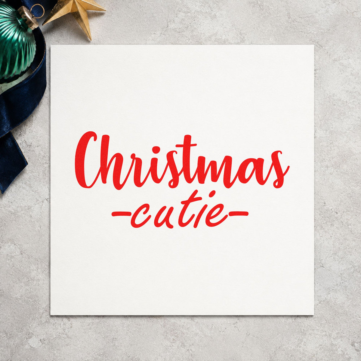 Christmas Cutie Script rubber stamp shown in red ink, stamped for projects such as bottle bag labels.