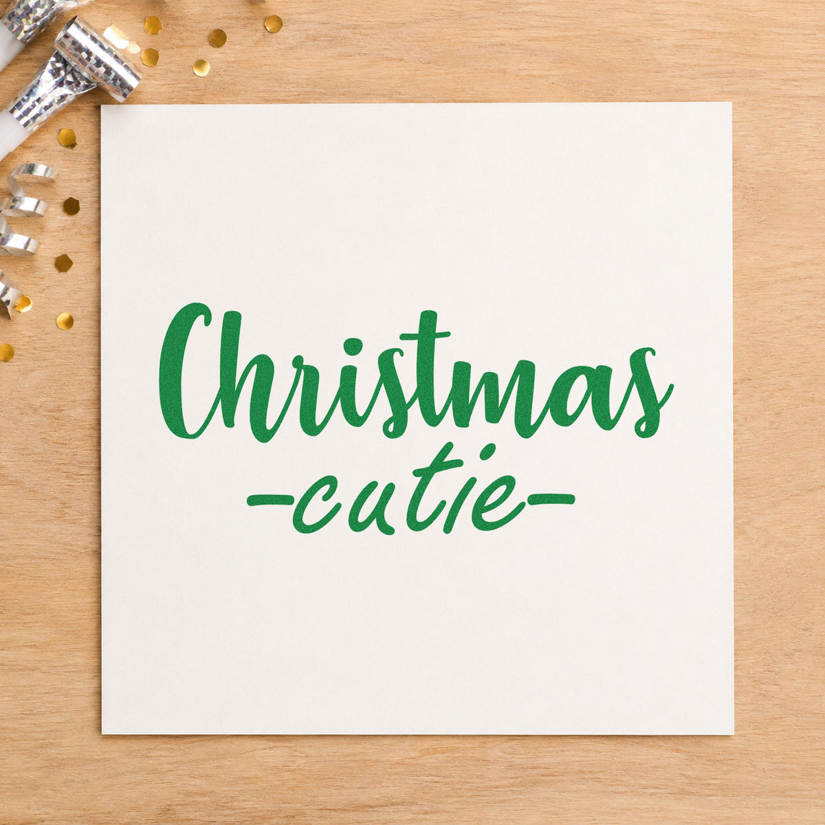 Christmas Cutie Script craft stamp imprint in green ink on a handmade project, one idea being photo session passes.