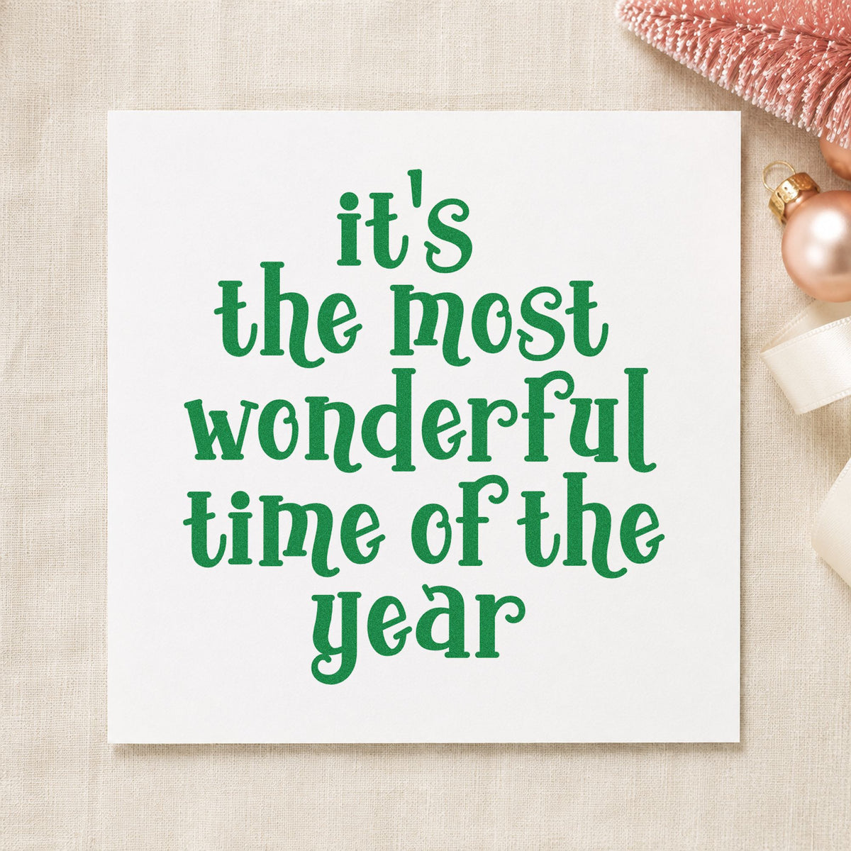 Most Wonderful Time Of Year craft stamp imprint in green ink on a handmade project, one idea being luggage tag cards.