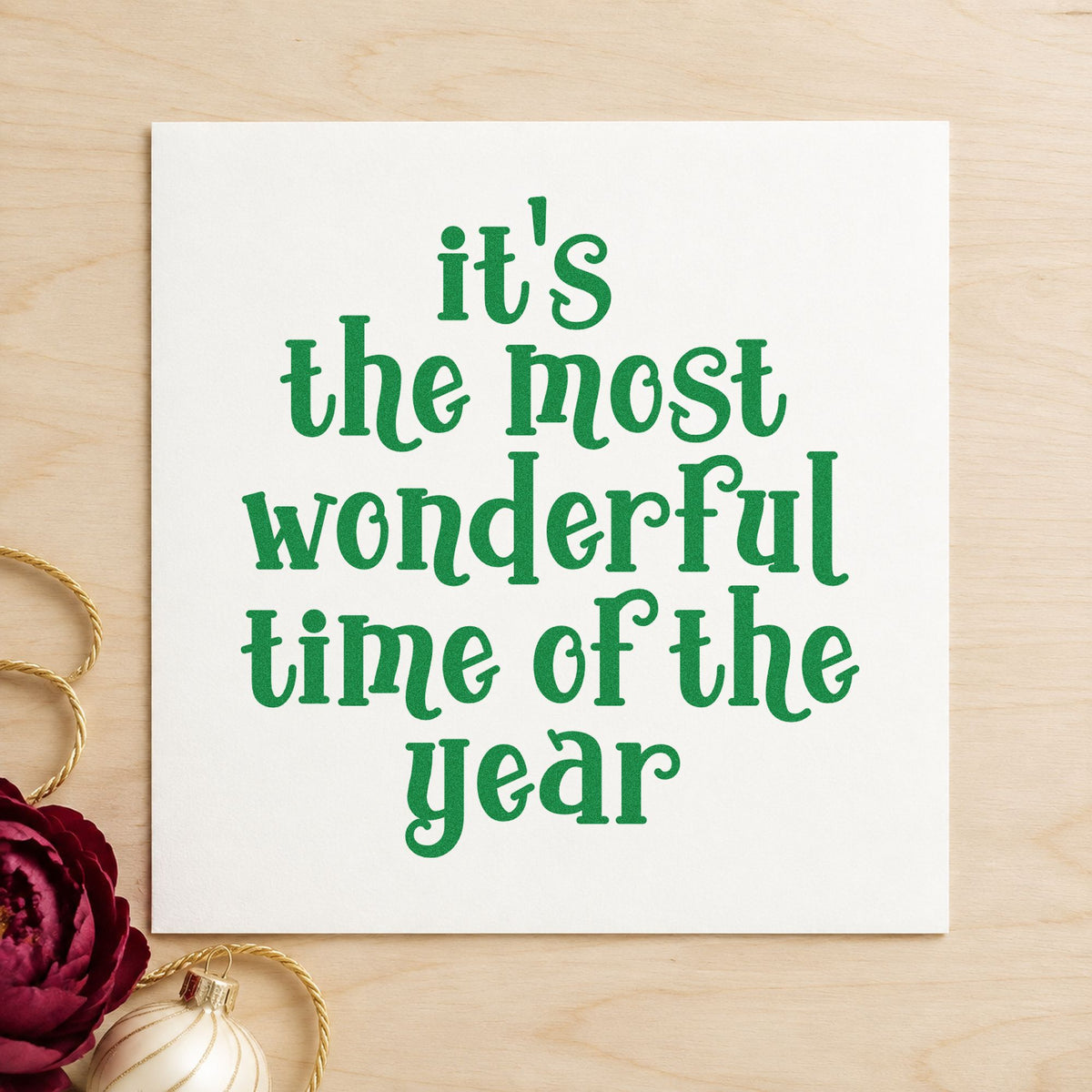 Most Wonderful Time Of Year craft stamp imprinted in green ink on paper, a design suited to framed guest bedroom.