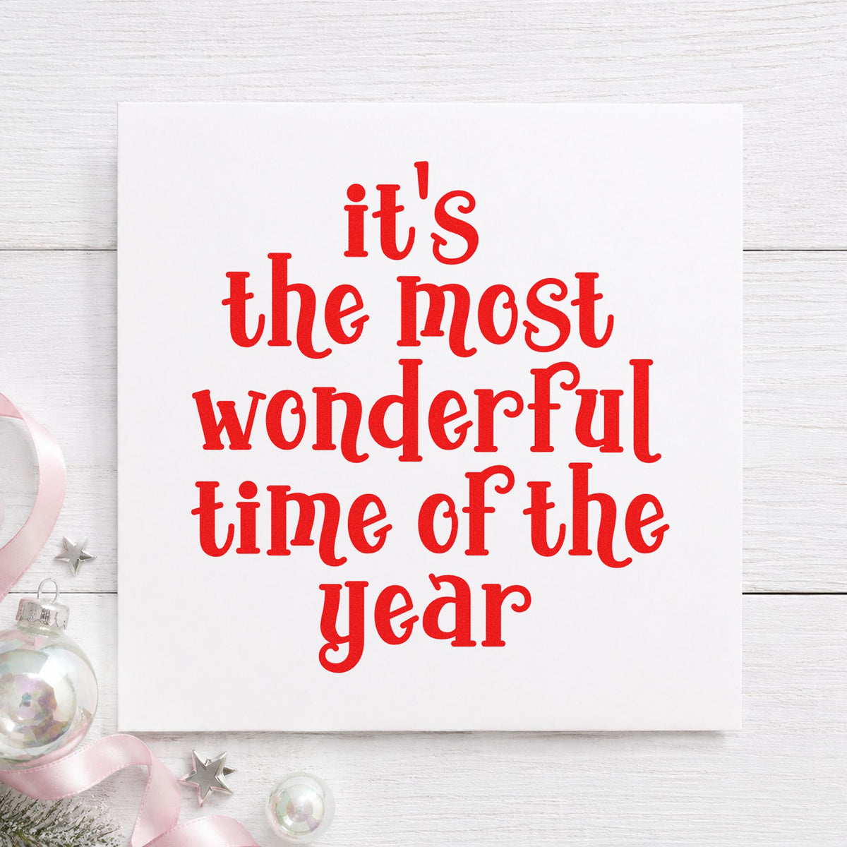 Most Wonderful Time Of Year rubber stamp shown in red ink, stamped for projects such as gift carry labels.