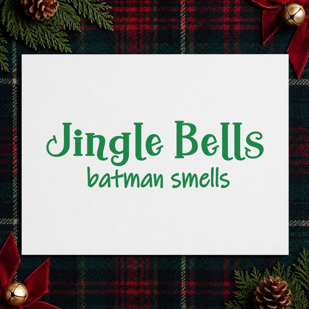 Jingle Bells Batman Smells craft stamp imprint in green ink on a handmade project, one idea being lunchbox note tags.