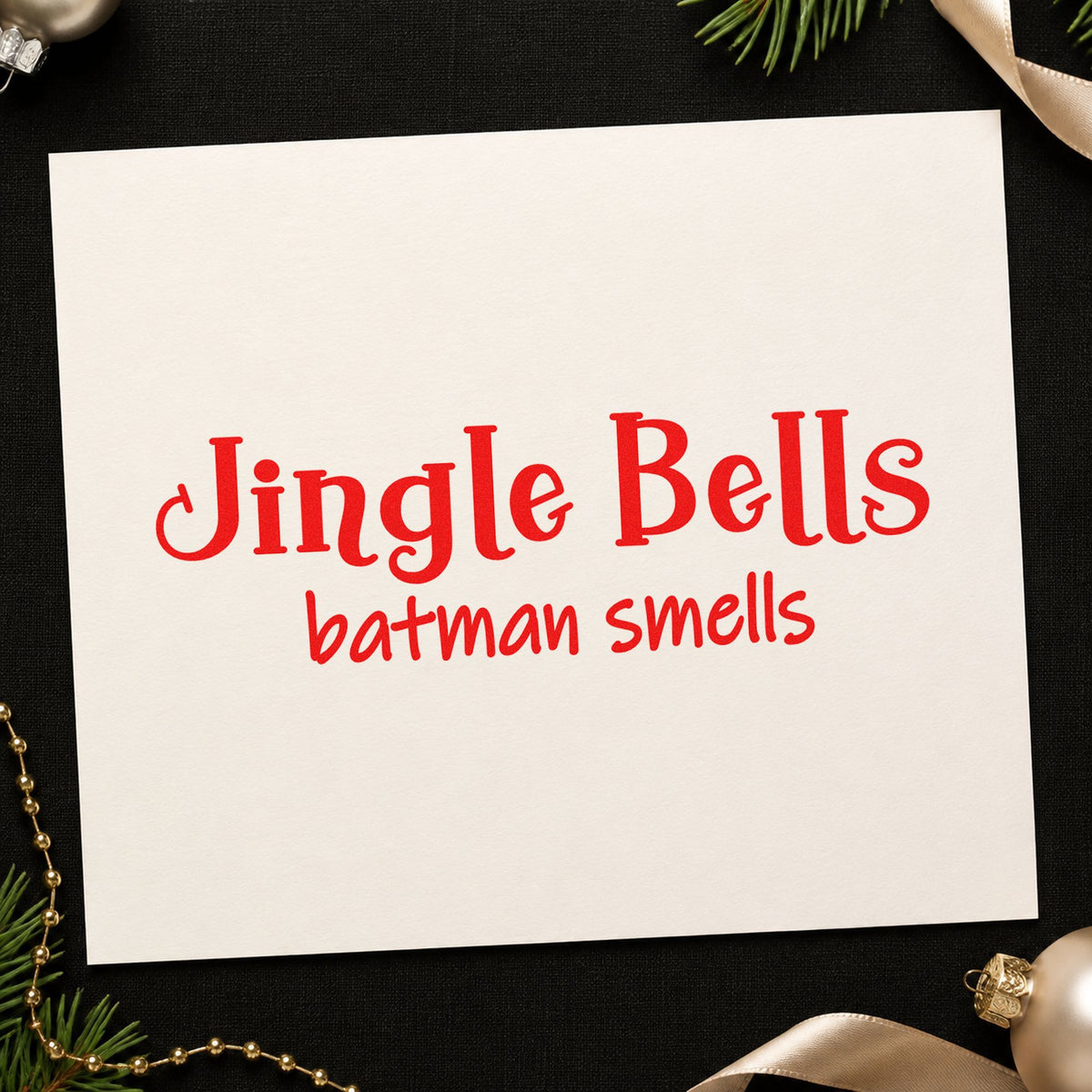 Jingle Bells Batman Smells craft stamp in red ink on cardstock, an easy option for backpack patch ink.