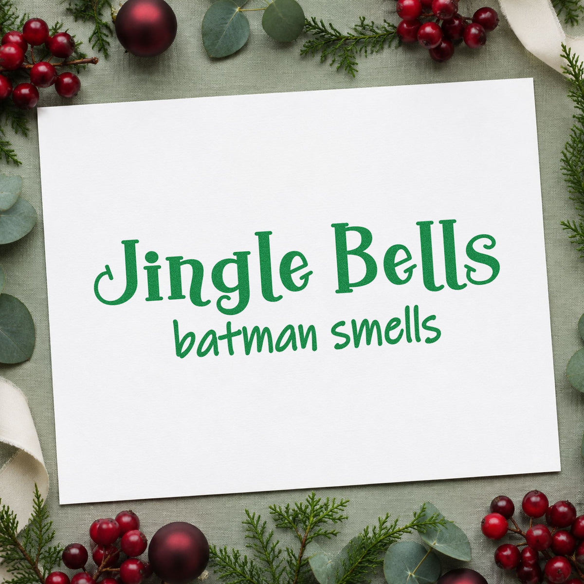 Jingle Bells Batman Smells craft stamp imprint in green ink on a handmade project, one idea being class party passes.