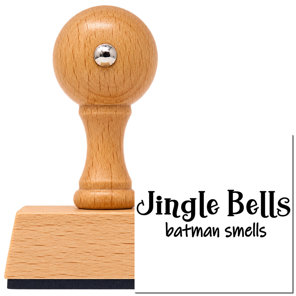 Jingle Bells Batman Smells Vintage Pro rubber stamp in European beech wood with a round knob handle, shown beside its black imprint.