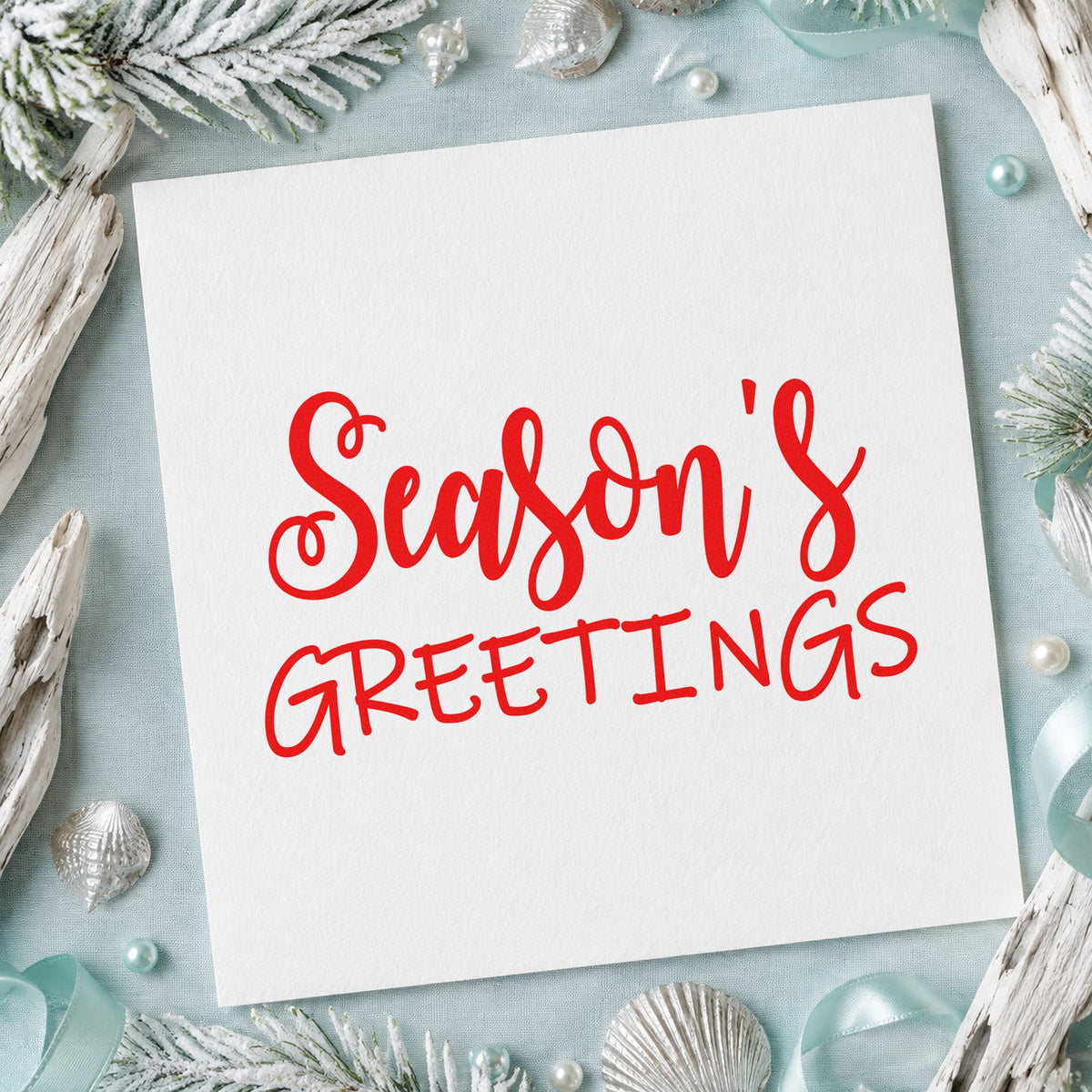 Season's Greetings Mixed Lettering craft stamp in red ink on cardstock, an easy option for robe pocket ink.
