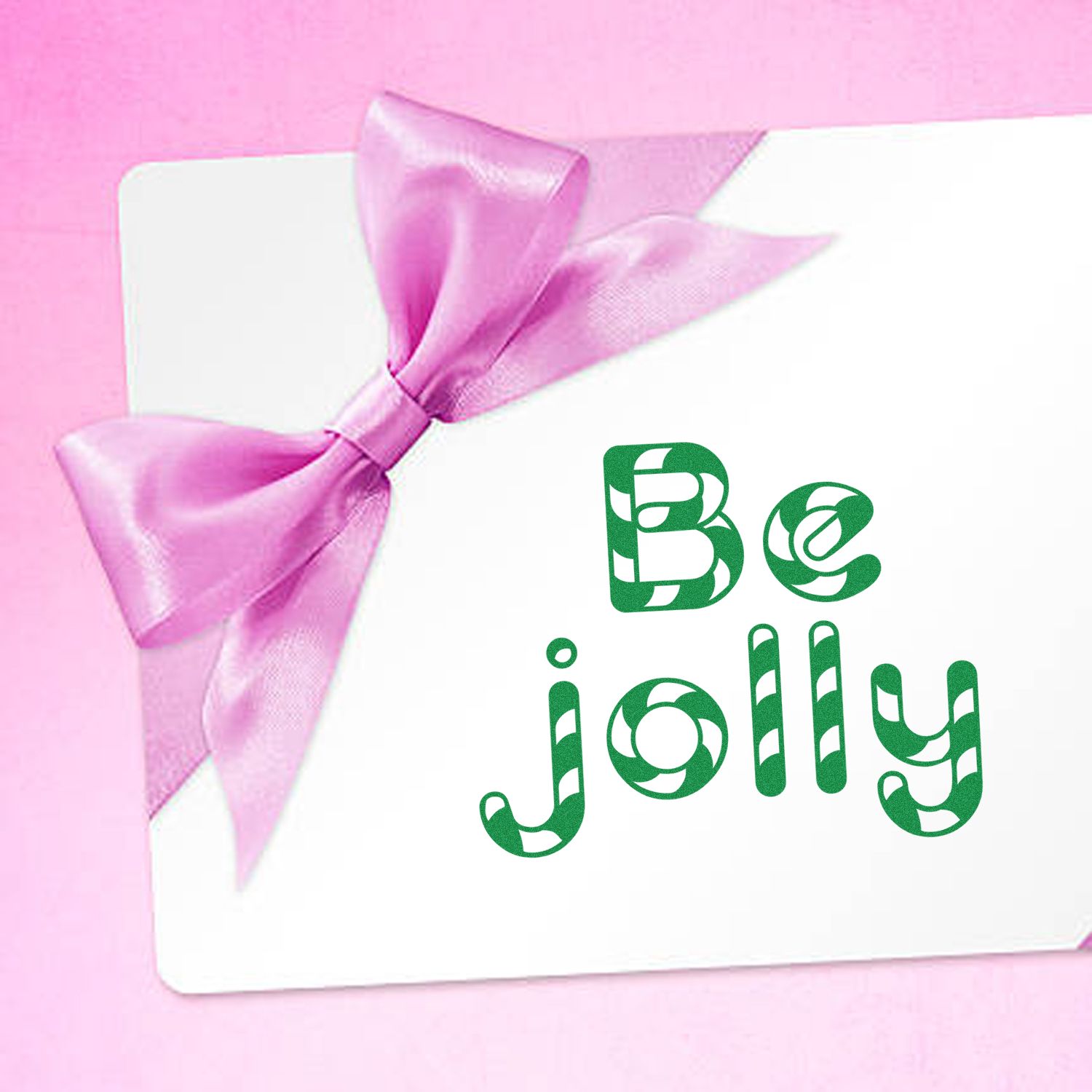 Be Jolly rubber stamp design on a holiday card with pink ribbon bow