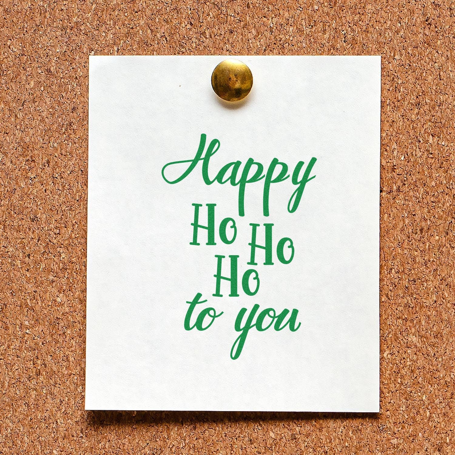 Christmas rubber stamp design reading Happy Ho Ho Ho to You in green script on a pinned card.