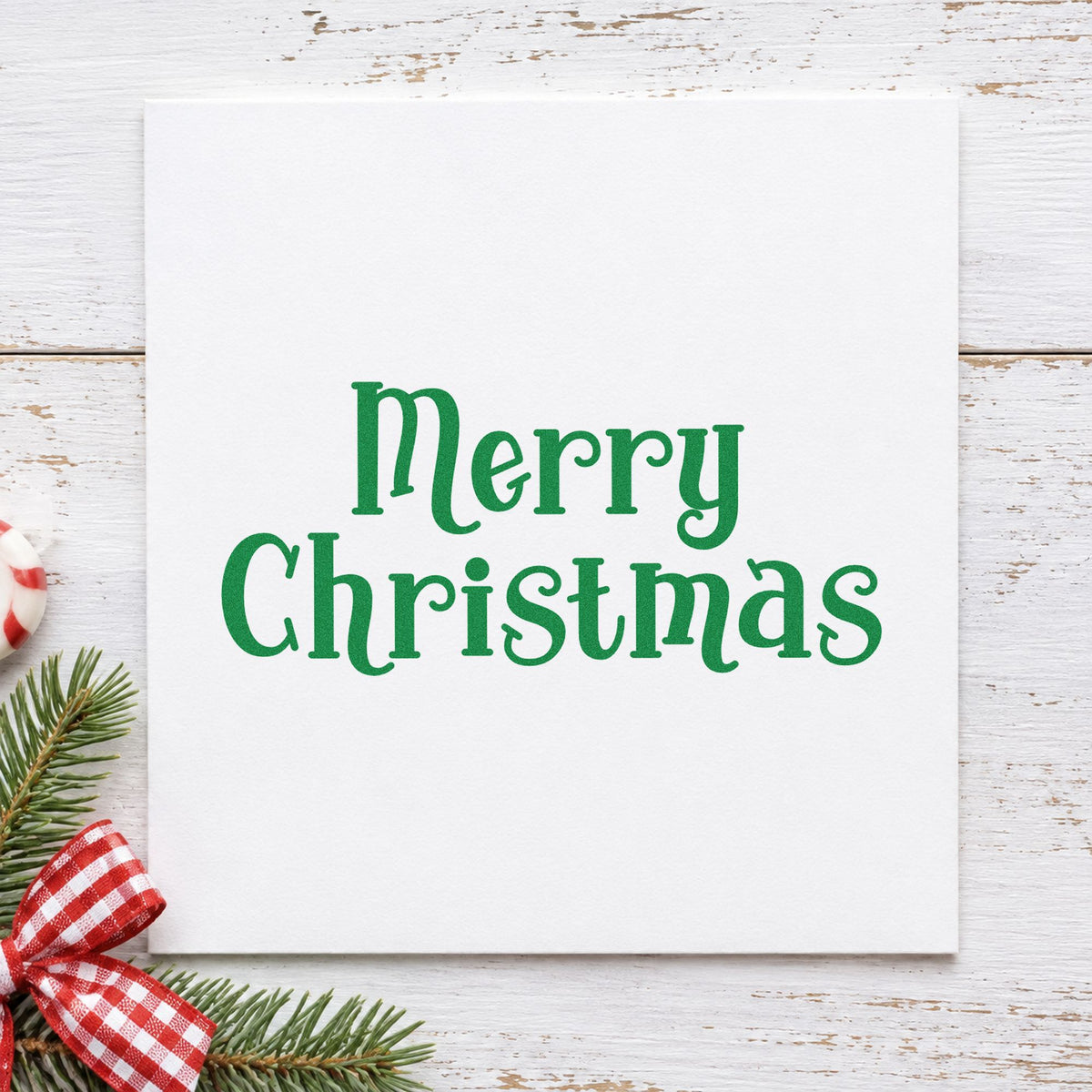 Merry Christmas Decorative Serif craft stamp imprint in green ink on a handmade project, one idea being heirloom gift tags.
