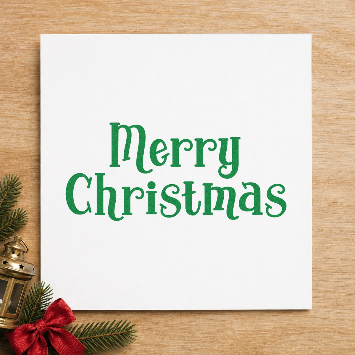 Merry Christmas Decorative Serif craft stamp imprinted in green ink on paper, a design suited to framed library shelf.