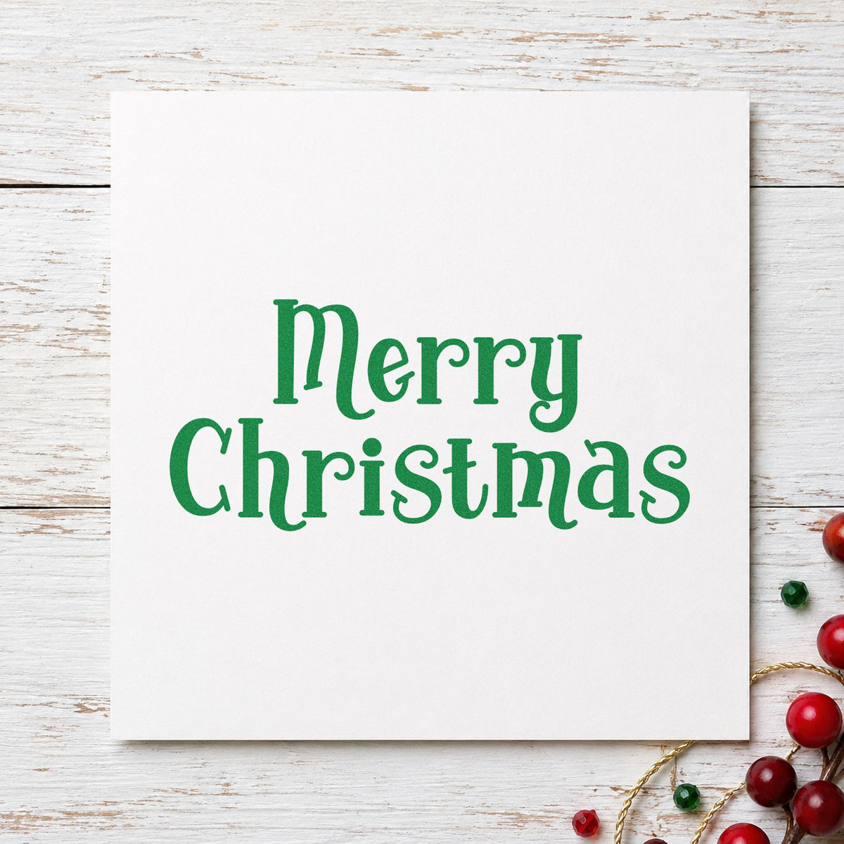 Merry Christmas Decorative Serif craft stamp imprint in green ink on a handmade project, one idea being estate dinner menus.