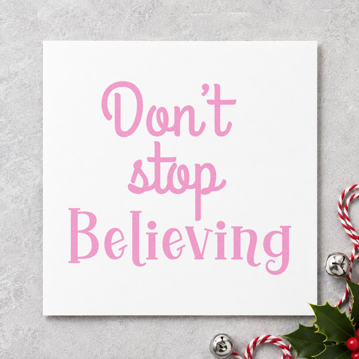 Don't Stop Believing craft stamp in purple ink on cardstock, an easy option for progress album page.