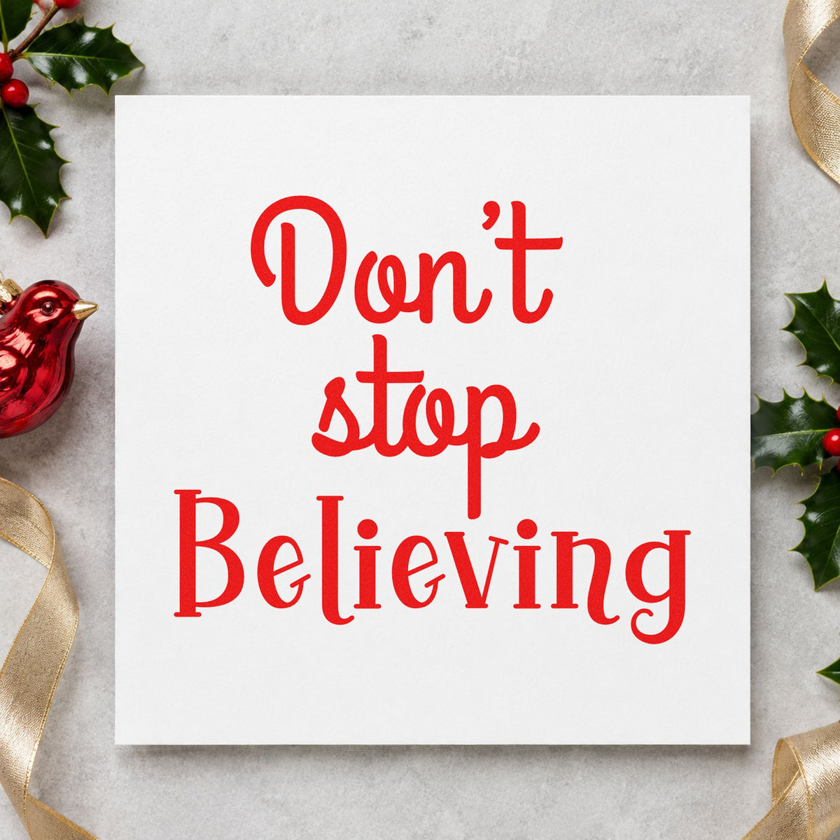 Don't Stop Believing rubber stamp shown in red ink, stamped for projects such as project bin labels.