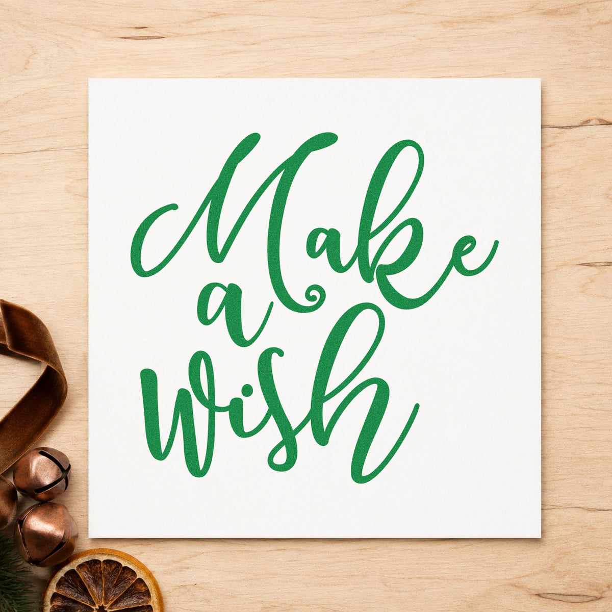 Make A Wish Script craft stamp imprint in green ink on a handmade project, one idea being party favor tags.