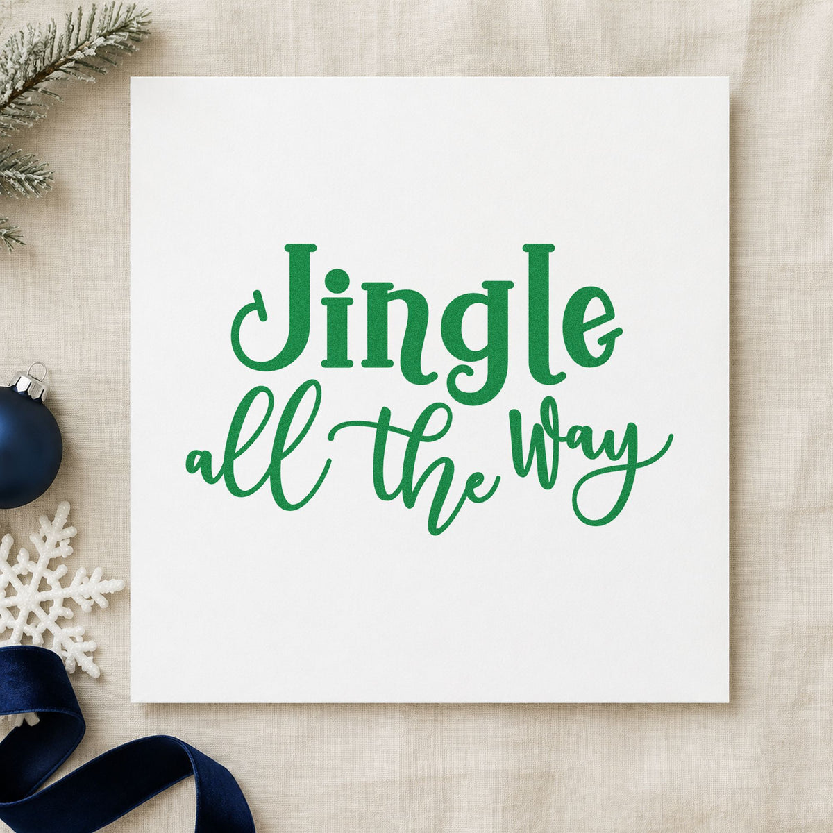Jingle All The Way Script craft stamp imprinted in green ink on paper, a design suited to framed workroom wall.