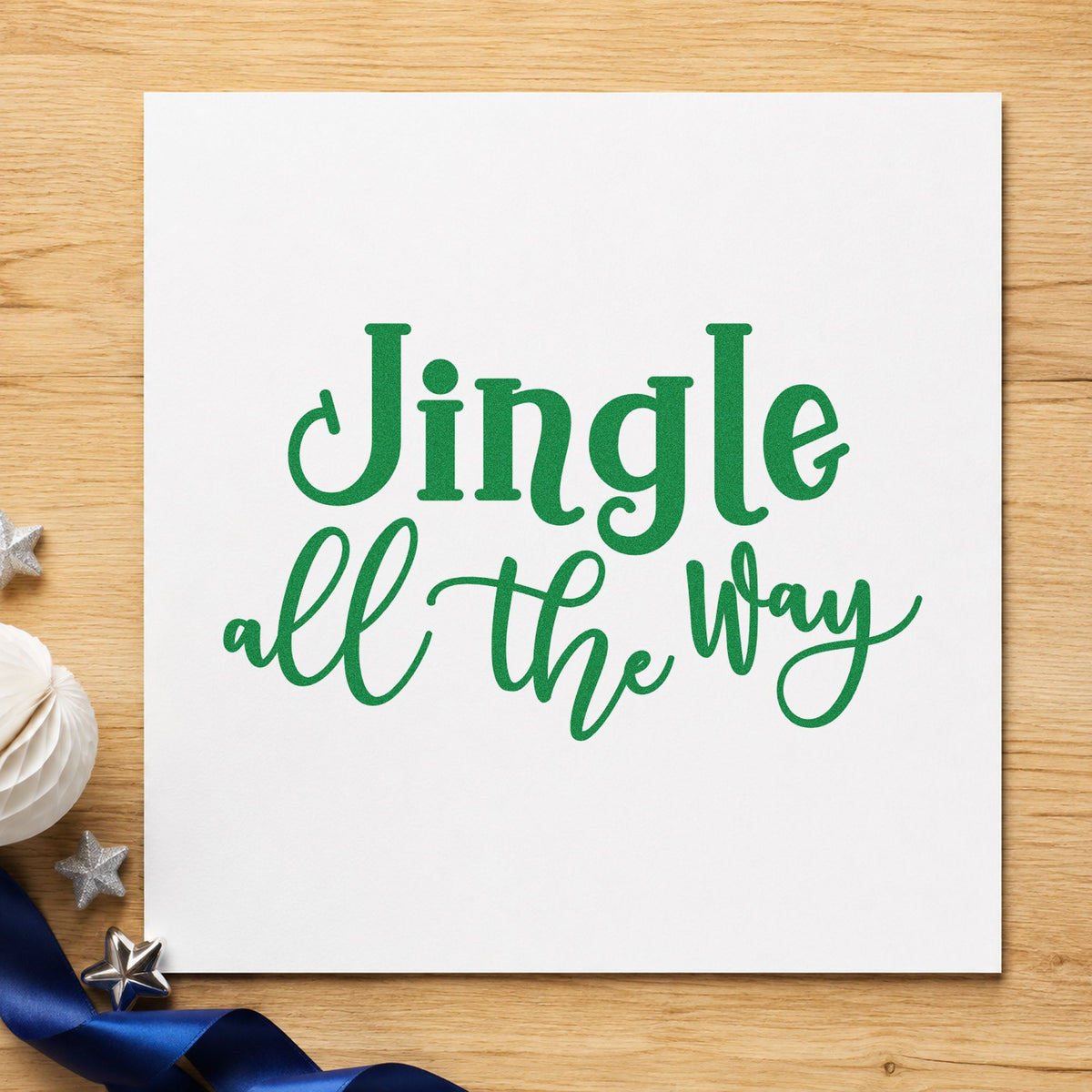 Jingle All The Way Script craft stamp imprint in green ink on a handmade project, one idea being make and take passes.